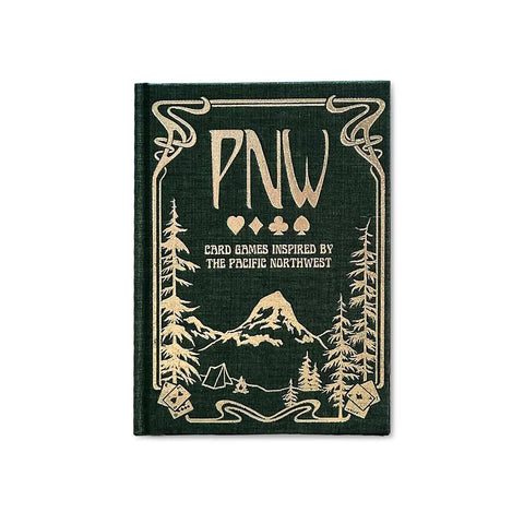 PNW: Card Games Inspired by the Pacific Northwest book cover featuring elegant gold foil lettering on a deep forest green background.