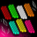 Metal alloy troop tokens for Wroth board game arranged in seven colorful faction groups against a dark background with decorative feather elements. 