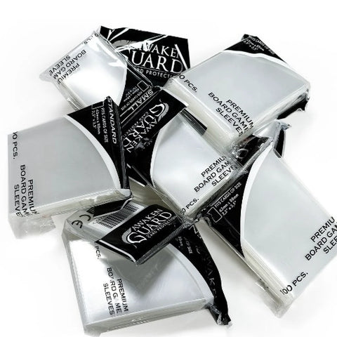 Multiple packages of Ultimate Guard Premium Board Game Sleeves scattered on a white background, showing clear protective card sleeves in their black and white packaging.