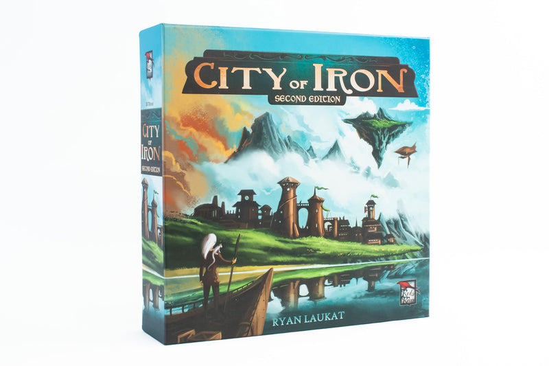 City of Iron Second Edition board game box featuring fantasy artwork with a medieval town, floating islands, and airships in a cloudy sky. The box art depicts a scenic landscape with stone buildings, towers, and a figure in a boat on a reflective river, all rendered in vibrant blues, greens, and warm earth tones.