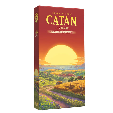 Box of Catan: The Game 5-6 Player Expansion, featuring a red box with yellow title text and Klaus Teuber's name as designer. The cover artwork depicts a sweeping landscape of fields, forests, and coastline with a large sunset over the ocean in the background.