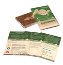 Earthborne Rangers Moments on the Path expansion showing the game box and sample cards spread out on a white surface. The green and tan colored box features the Earthborne Rangers logo with mountain imagery, while three large cards display game text and nature-themed artwork in earth tones.
