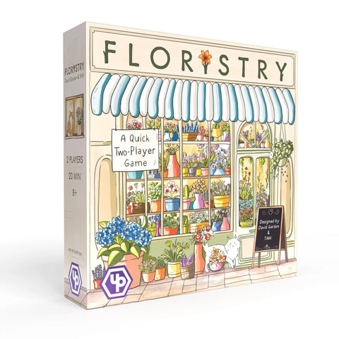 Box art for Floristry featuring a colorful illustration shows a charming flower shop storefront with blue and white striped awning, featuring various potted flowers and plants displayed in the window and outside the shop.