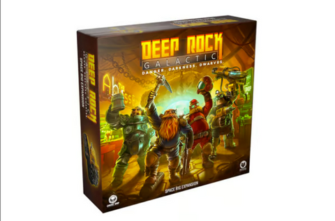 Deep Rock Galactic board game box featuring four armored dwarf miners in a glowing underground cavern environment. The box art shows the dwarves equipped with mining gear and weapons against a backdrop of golden cave walls and green lighting effects. The game's distinctive orange and yellow logo is prominently displayed at the top of the package.