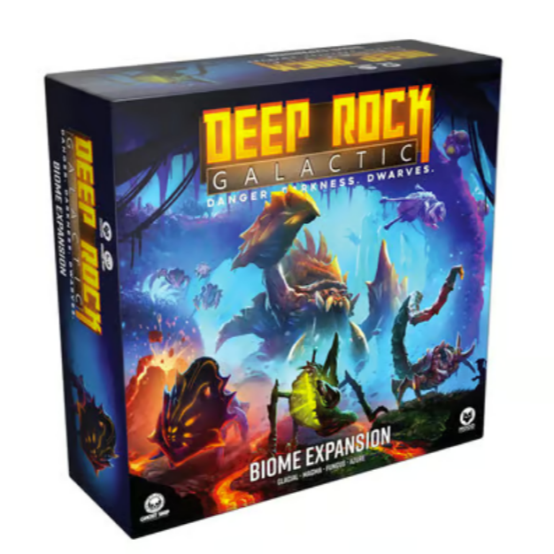 Deep Rock Galactic Biome Expansion board game box featuring dramatic underground cave artwork with alien creatures and mining dwarves in action. The box displays vibrant blue and orange lighting effects with crystalline formations and hostile alien life forms scattered throughout a subterranean landscape. The packaging prominently shows this is an expansion for the cooperative mining-themed board game with "Danger. Darkness. Dwarves." tagline visible on the cover.
