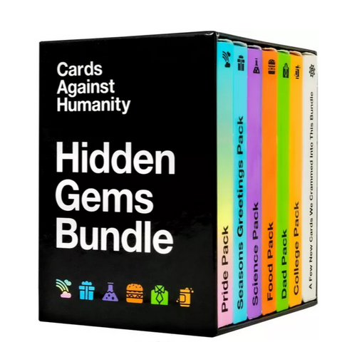 Cards Against Humanity Hidden Gems Bundle showing a black box set containing seven colorful expansion packs arranged in a row. 