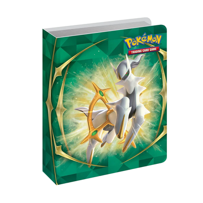 The small binder showcases the white and gold legendary Pokémon Arceus surrounded by a radiant yellow energy effect on its emerald-colored cover.