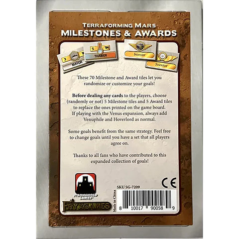 Back of Terraforming Mars Milestones & Awards expansion package showing brown Mars-themed design with sample milestone and award tiles displayed at the top. The package includes text explaining the 70 milestone and award tiles for randomizing or customizing goals, with Stronghold Games branding and product details at the bottom.
