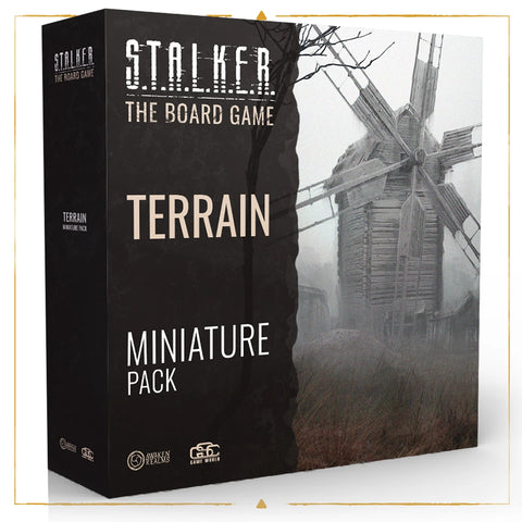 Box packaging for the S.T.A.L.K.E.R. The Board Game 'Terrain Miniature Pack' expansion, featuring a black box design with white text and an atmospheric black and white image of a dilapidated windmill in a foggy landscape.
