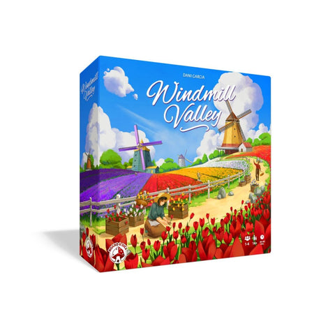 Windmill Valley board game box featuring a colorful Dutch countryside scene with traditional windmills, vibrant tulip fields in red and purple, and a farmer working among the flowers. The box art depicts a pastoral landscape with rolling hills, fluffy white clouds, and multiple windmills scattered across green fields under a bright blue sky. The game title "Windmill Valley" is prominently displayed in elegant white script lettering at the top of the box.