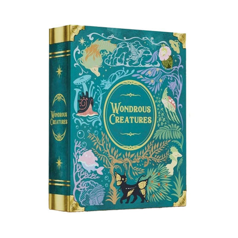Wondrous Creatures board game box featuring an ornate teal and gold design with fantastical illustrated creatures including mermaids, sea life, and mythical animals. The decorative cover has an elegant vintage book aesthetic with gold corner embellishments and ornamental borders surrounding the central title.