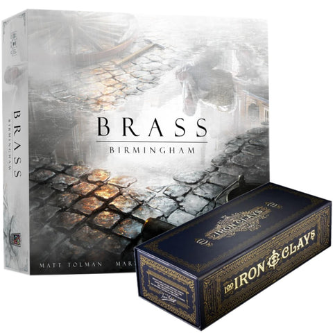 Brass: Birmingham board game box showing the main game box with cobblestone street artwork alongside a smaller dark blue Iron & Clay poker chip set box. The main box features atmospheric industrial-era artwork with weathered stone pathways and misty buildings, displaying the game's title prominently in elegant typography.