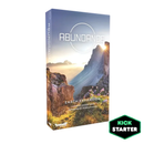 Box cover of Abundance, an Earth Expansion board game, featuring dramatic mountain scenery with sunlight peeking over a cliff edge. The packaging shows a serene landscape with misty valleys, rocky cliffs, and small wildflowers in the foreground. A Kickstarter badge appears in the bottom right corner, indicating this is a crowdfunded game expansion.