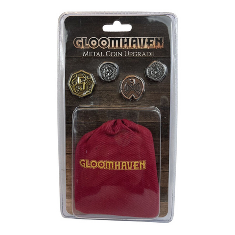 Gloomhaven Metal Coin Upgrade package showing four different metallic coins and a red drawstring pouch. The package displays gold, bronze, and silver coins with various Gloomhaven-themed designs including emblems and symbols. The coins are arranged above a burgundy cloth bag with "GLOOMHAVEN" embroidered in gold lettering.