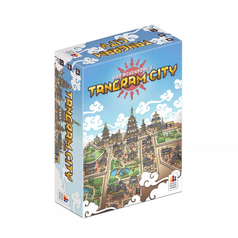 Tangram City board game box showing a colorful illustrated medieval fantasy city with pagodas, towers, and buildings arranged in geometric sections. The box features a bright blue sky with white clouds and the game title in bold yellow letters with a red sun design.