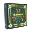 Playmats Harvest board game box featuring an ornate green design with decorative golden borders, floral corner medallions, and orange monarch butterflies scattered across a botanical background. The box displays "PLAYMATS" in large yellow lettering with "HARVEST" beneath it, all framed by an elegant Art Nouveau-style border with leaf and wheat motifs. 