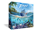 Reef Project board game box featuring a split-scene artwork with a research vessel on the ocean surface above and scuba divers exploring a vibrant coral reef below. The tropical setting includes palm trees and islands in the background, while underwater scenes show colorful coral formations, marine life, and diving equipment. The box displays the Board & Dice publisher logo.