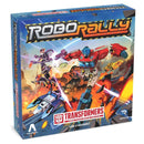 Robo Rally: Transformers board game box featuring dynamic artwork of colorful robot warriors in combat poses amid an explosive battlefield scene. The box displays the distinctive Robo Rally logo with metallic styling and the red Transformers Autobot symbol prominently featured at the bottom.