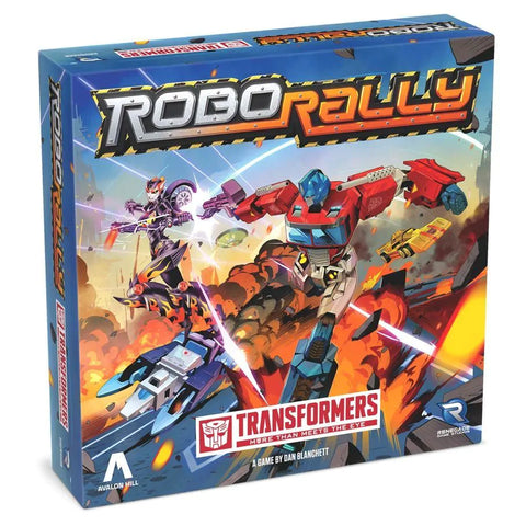 Robo Rally: Transformers board game box featuring dynamic artwork of colorful robot warriors in combat poses amid an explosive battlefield scene. The box displays the distinctive Robo Rally logo with metallic styling and the red Transformers Autobot symbol prominently featured at the bottom.