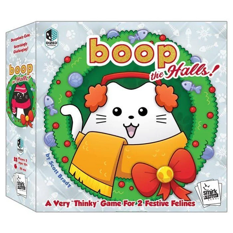 This is a product image for "boop the Halls!" board game, showing its holiday-themed box art featuring a cartoon white cat with orange ears wearing a yellow scarf within a green Christmas wreath. 