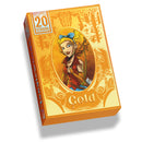 Tanglewoods Gold board game box featuring illustrated blonde character with blue bow in forest setting. The orange and yellow packaging displays decorative woodland motifs including trees, leaves, and swirling patterns around the central character portrait. The box indicates it's part of the 20 Strong solo gaming system with bold orange branding in the top left corner.