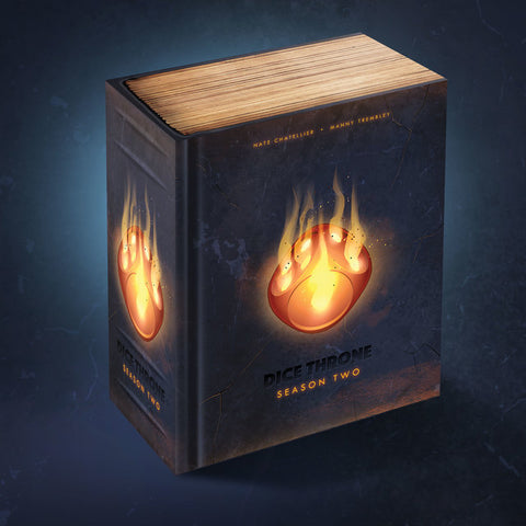 Dice Throne Season Two battle chest box, which features a premium wooden-topped design with flaming dice emblems on the black sides. 